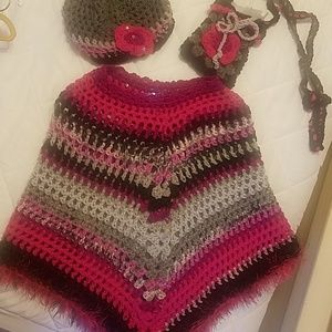 Handmade poncho with matching hat and purse.